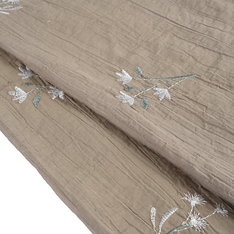 Tela arrugada con flor bordada de orquídeas y semillas de melocotón