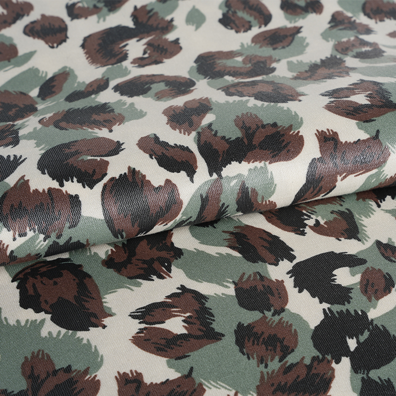 Tela de algodón dorado engrosada con estampado de leopardo de tres colores 20D*21S